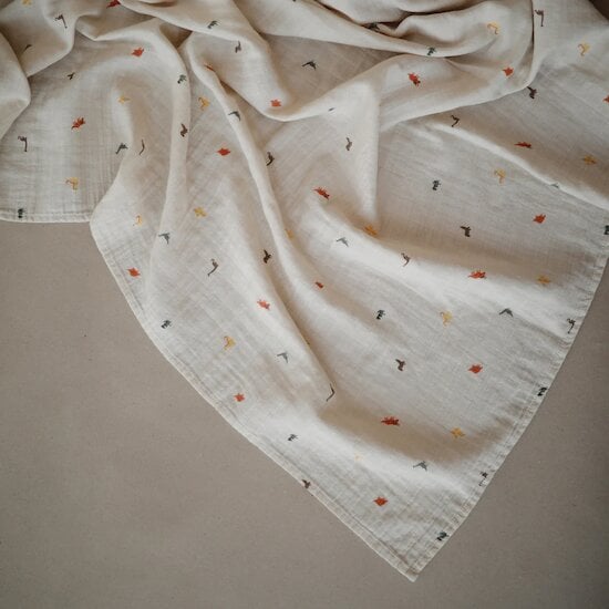 Maxi lange mousseline en coton bio Dinos  de mushie Maxi lange mousseline en coton bio Dinos  de mushie